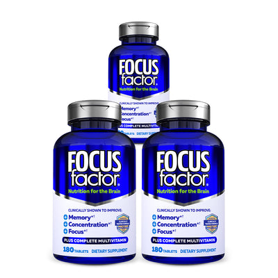 Three bottles of Focus Factor® Original† dietary supplement are showcased, emphasizing brain nutrition. The labels highlight clinically tested formulas that boost memory, concentration, and focus with a complete multivitamin.